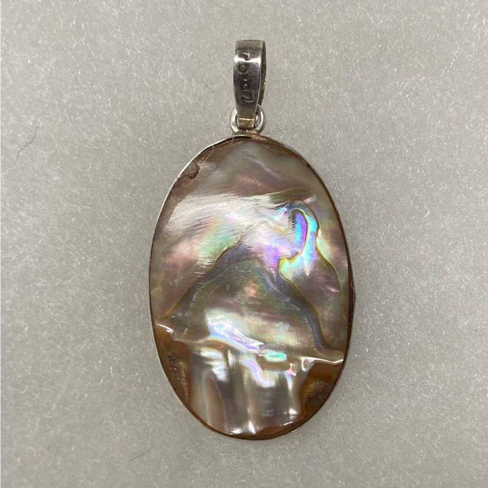 Two sided mother of pearl and abalone with sterling silver bezel setting